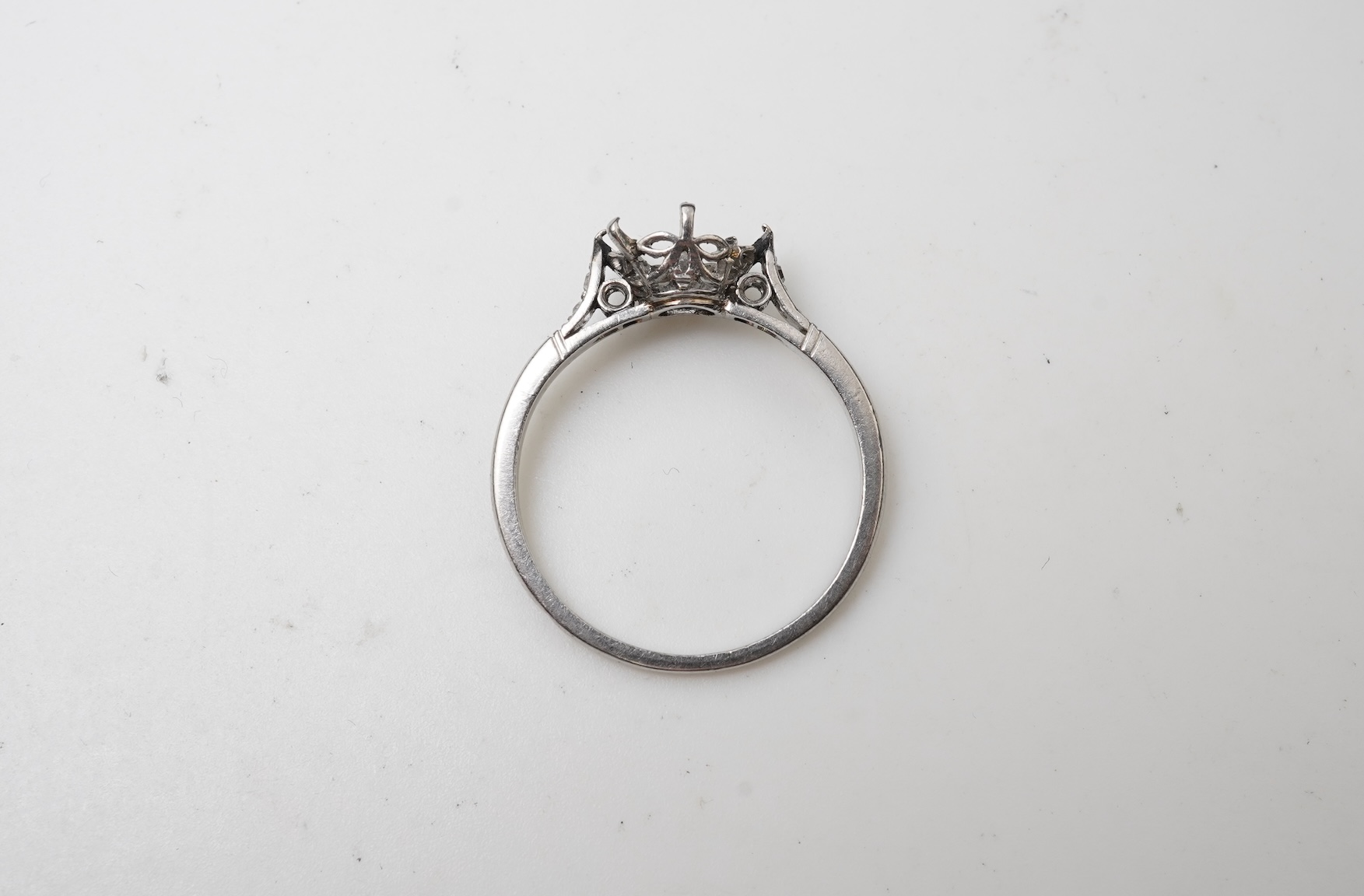 A platinum and diamond ring mount, France, early 20th century